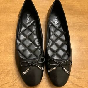 MICHAEL Michael Kors Black Flats with Silver Accents